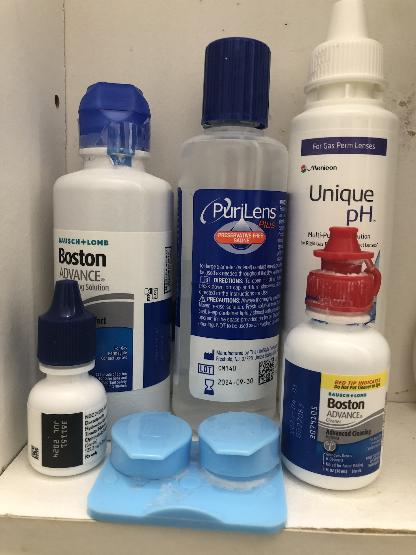 various bottles of cleaning solutions and eye drops